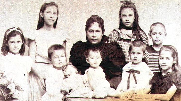 Mrs Kloppenburg surrounded by her children, Semarang.